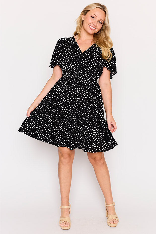 Remi Black Irregular Spot Dress โ Black Irregular Spot knee length dress