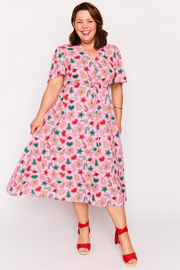 Marley Pink Gingerbread Cookie Christmas Dress โ Pink Gingerbread Cookie Christmas midi dress