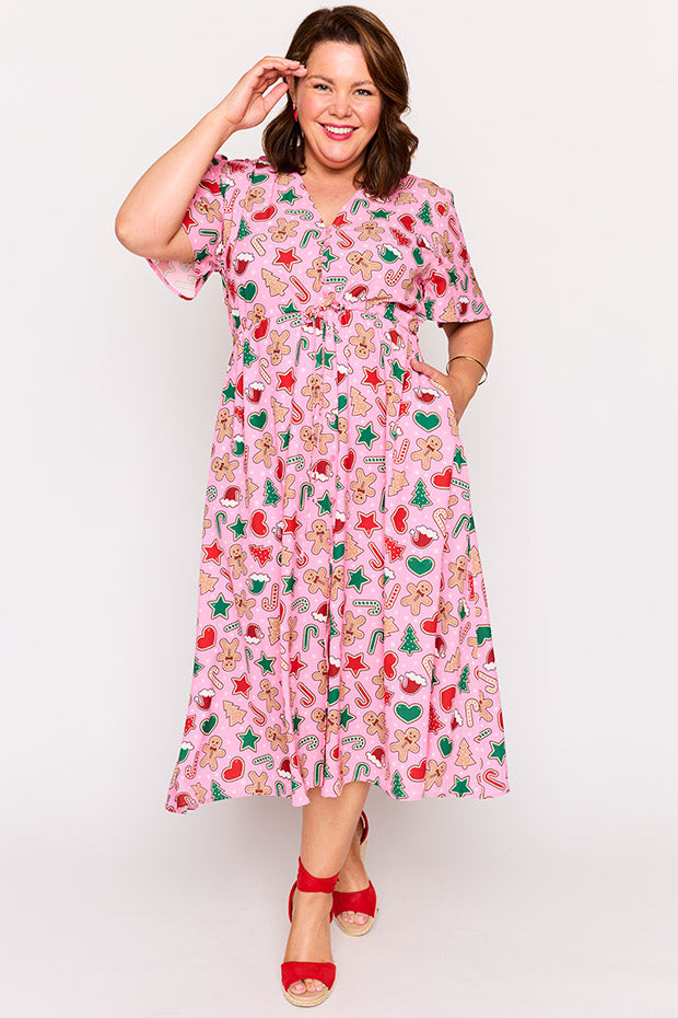 Marley Pink Gingerbread Cookie Christmas Dress โ Pink Gingerbread Cookie Christmas midi dress