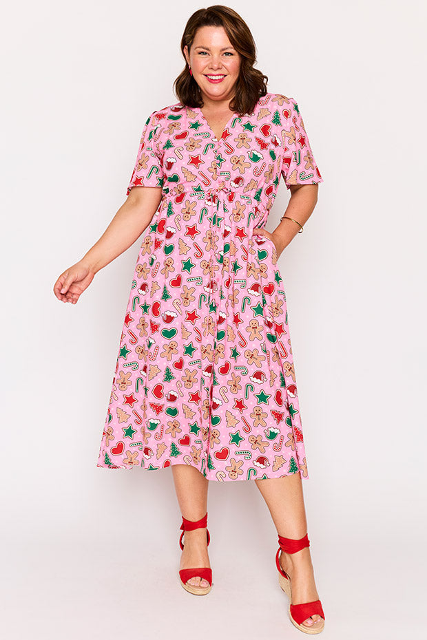 Marley Pink Gingerbread Cookie Christmas Dress โ Pink Gingerbread Cookie Christmas midi dress