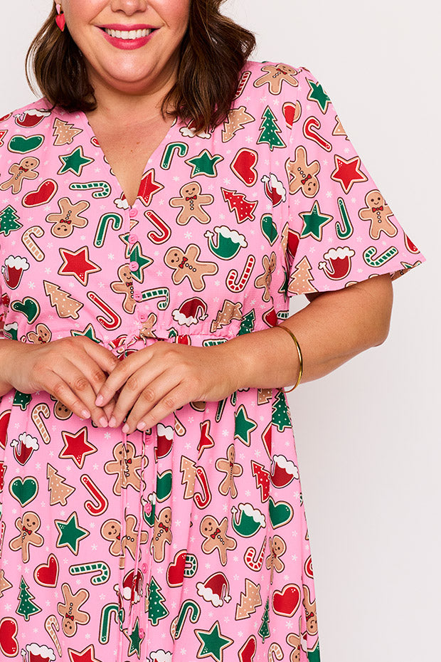 Marley Pink Gingerbread Cookie Christmas Dress โ Pink Gingerbread Cookie Christmas midi dress