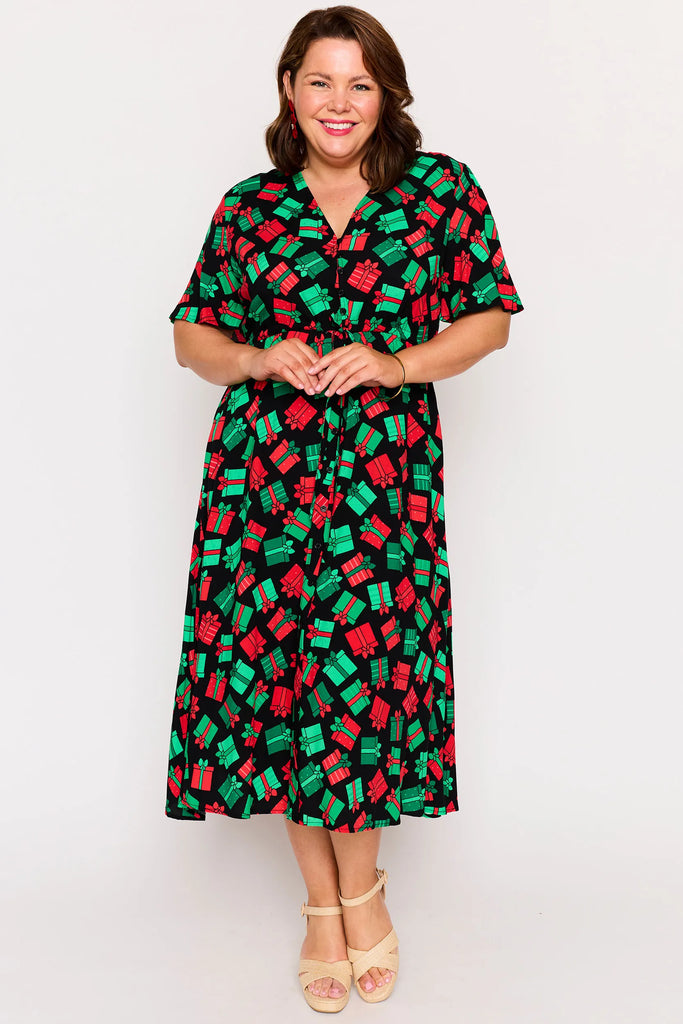 Model Full view – Michelle dress in Christmas Presents print, red and green presents pattern