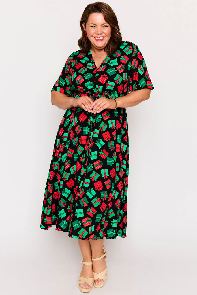Front view - Full Body – Michelle dress in Christmas Presents print, red and green presents pattern