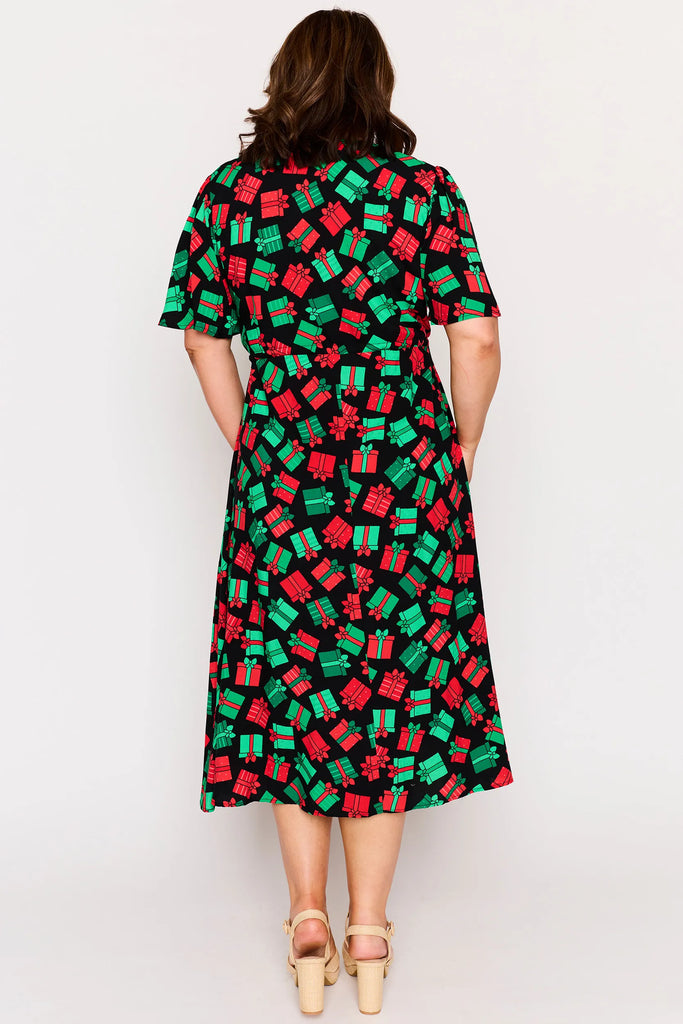 Back view - Full Body – Michelle dress in Christmas Presents print, red and green presents pattern