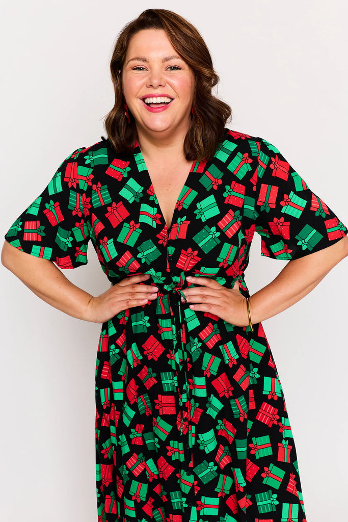 Close-up - Neckline Detail – Michelle dress in Christmas Presents print, red and green presents pattern