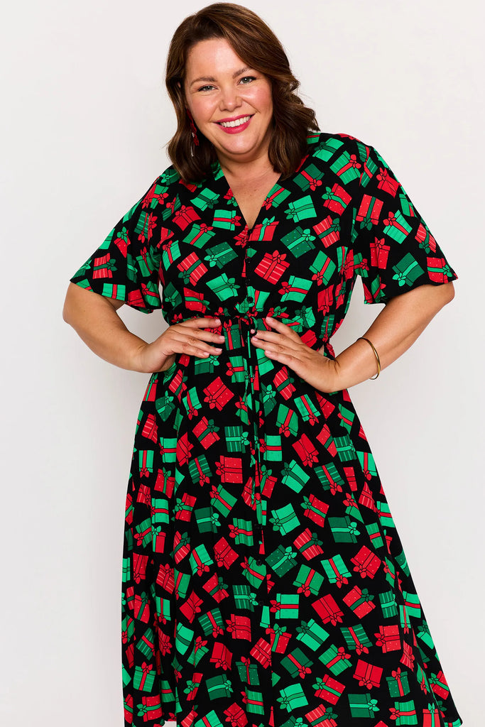 Close-up - Waist Detail – Michelle dress in Christmas Presents print, red and green presents pattern