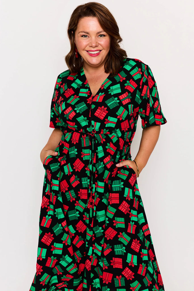 Close-up - Pocket Detail – Michelle dress in Christmas Presents print, red and green presents pattern