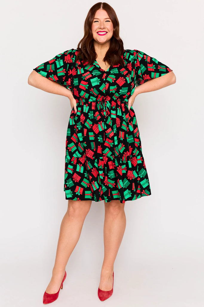Front View - waist detail – Remi dress in Christmas Presents print, white base with red and green gifts