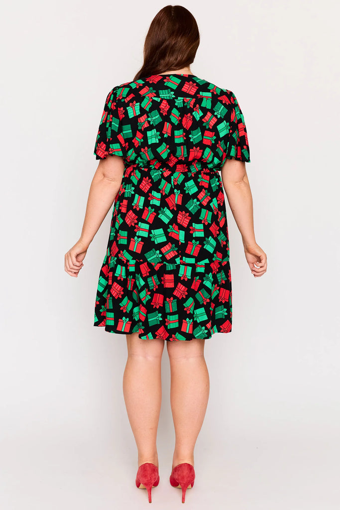 Back view – Remi dress in Christmas Presents print, white base with red and green gifts